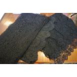A quantity of late 19th and early 20th Century black lace, a black lace shawl and a fine panel of