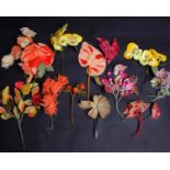 A quantity of early 20th Century silk and velvet millinery flowers and berries