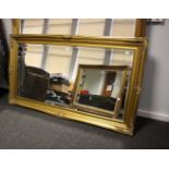 A large gilt frame mirror with bevelled glass plate, 136 x 80cm.