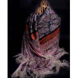 A 1920s colourful fringed silk shawl; a black net embroidered shawl and an off-cut of 19th Century