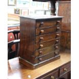 A 19th Century miniature chest of drawers with six long drawers. 43cm (h)