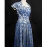 A 1930s cream lace full length dress; a late 1940s Spafford Jones black silk velvet full length