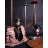 Three 1930s hat stands, one decorated with a boudoir doll head, a Pierrot head tea cosy and a wooden