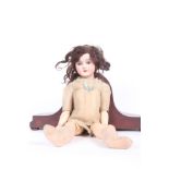 Simon and Halbig bisque socket head doll, with a brown wig, sleeping blue/grey eyes, an open mouth
