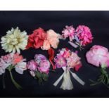 A collection of early 20th Century silk and velvet corsage flowers, including roses and peonies. A