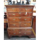 An early 18th century walnut and feather banded chest on chest, two short over three long drawers,
