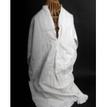 A quantity of late 19th and early 20th Century nightgowns, slips, chemise and similar garments (a