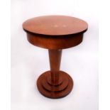 A late 20th century Art Deco style circular walnut veneered side table, single drawer to tapering