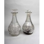 A pair of Regency decanters with hobnail decoration. 22cm high to lip. One with later stopper.