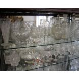 A large collection of Victorian and later cut and pressed glass to include seven decanters, brandy