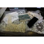 A collection of early and mid 20th Century lace and trimmings; a length of pale blue sequin