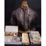 A 19th Century grey and cream silk bodice; a quantity of 18th Century silk fragments, a box of