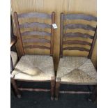 A pair of oak ladder back dining chairs, with rush seats and two other chairs (4)