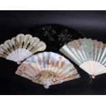 A 19th Century white and gold pressed card fan linked with blue ribbon; an Oriental black and silver