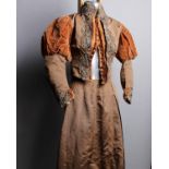 A late 19th Century light brown silk and velvet two piece wedding outfit embellished with coloured