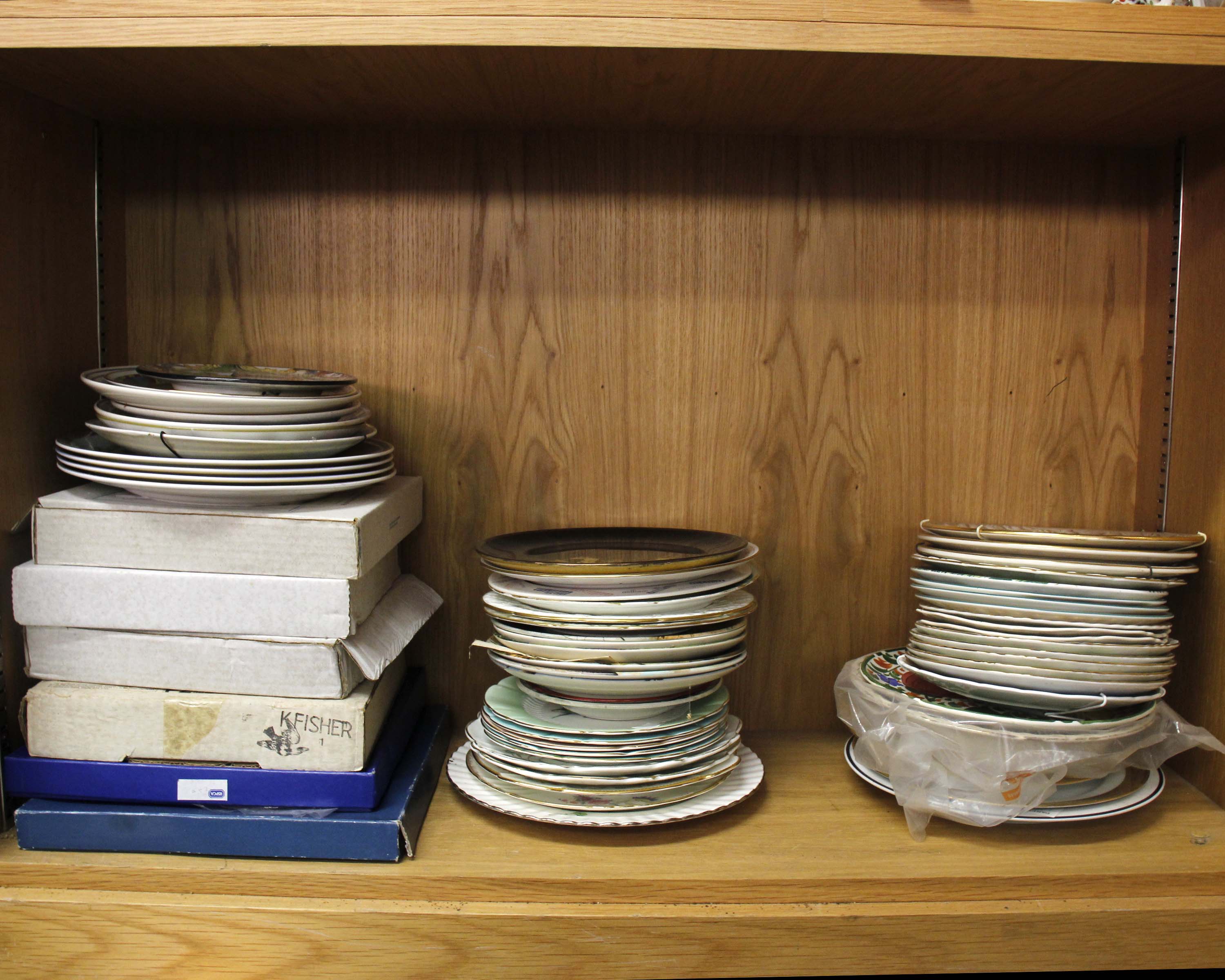 A large collection of decorative and collectors plates.