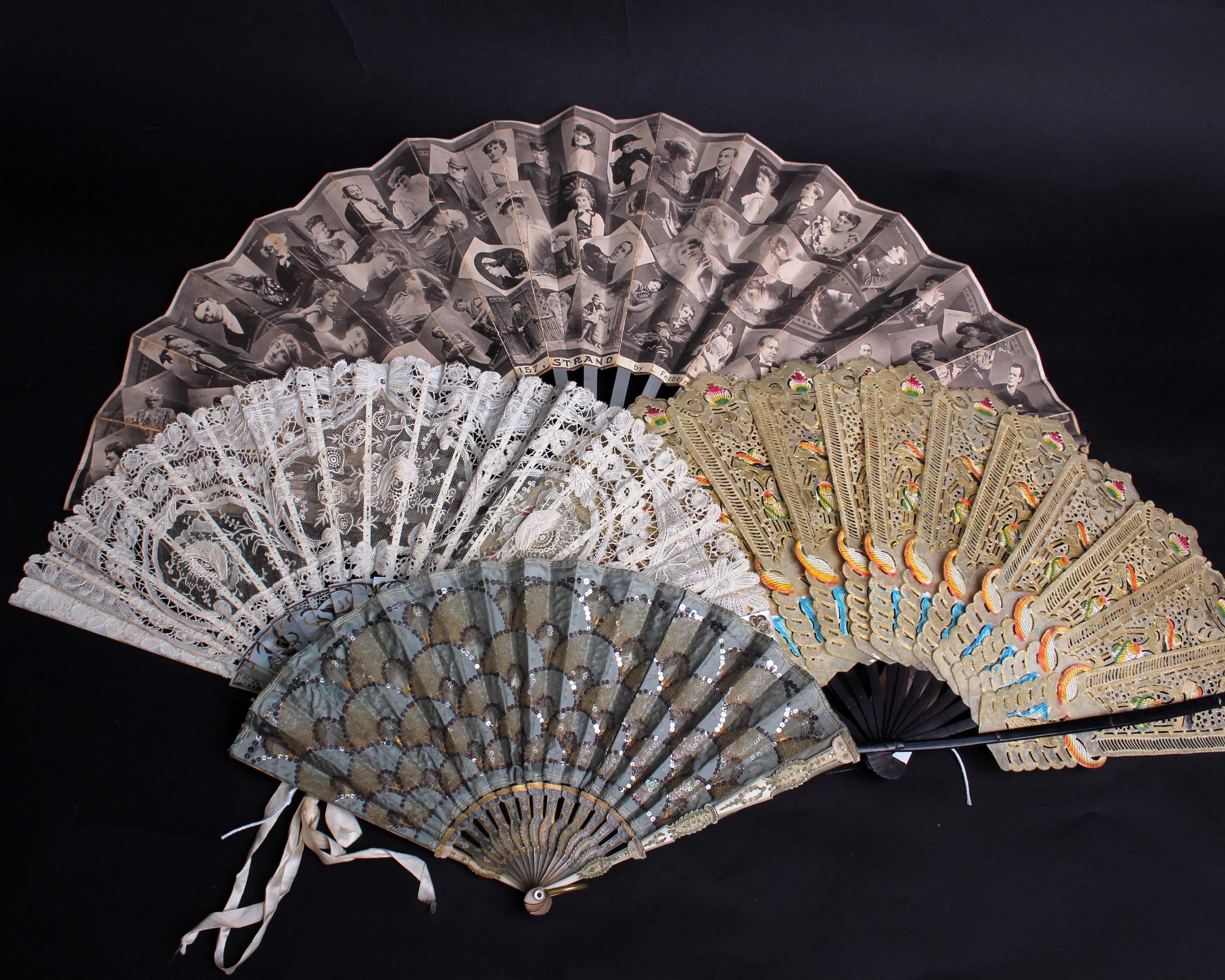 A late 19th Century Brussels lace fan within a silk box, the mother of pearl sticks and guards