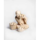 A Japanese carved ivory Okimono of an egg seller, Meiji period, the seated figure holding an egg