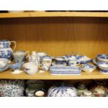 A collection of blue and white pottery and porcelain to include willow pattern and Spode.