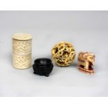 A collection of Ivory items to include an intricately carved four piece puzzle ball, an ivory lidded