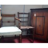 A George III oak corner cupboard, an upholstered armchair and side chair.