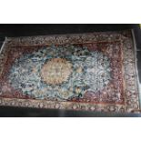 A Tabriz rug, with a central medallion, 154 x 94cm.