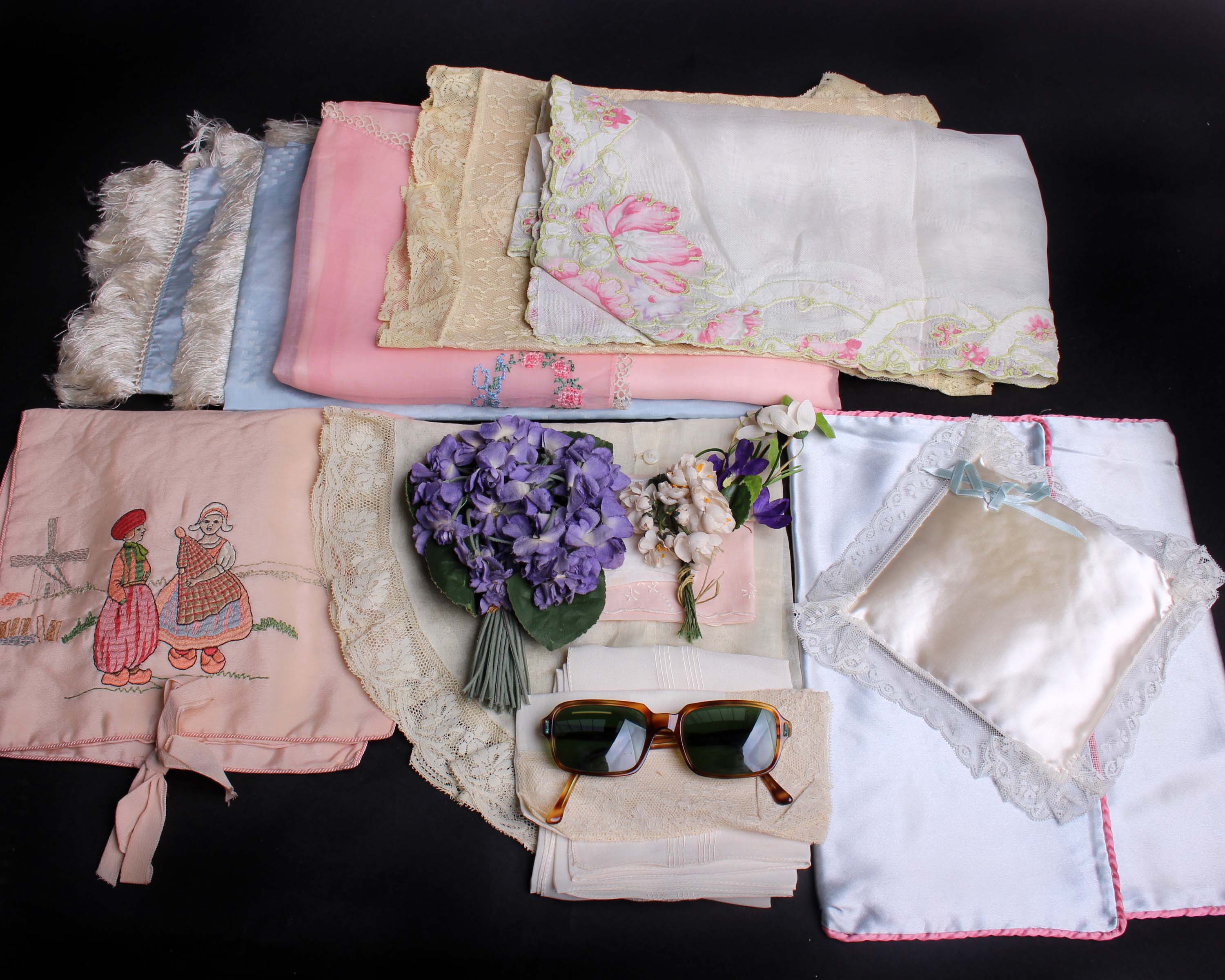 Two bunches of millinery flowers; a pair of 1940s sun glasses, cotton handkerchiefs, a quantity of