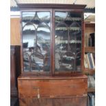 A George III mahogany secretaire bookcase, two glazed doors over single long drawer and two cupboard