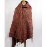 A 19th Century paisley wool shawl; a late 1960s orange and pink Merion Mill Welsh wool blanket and a