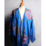 An early 20th Century blue silk kimono robe lined with green silk and decorated with hand-stencilled
