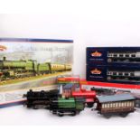 Hornby. A large collection of '0' gauge and '00' gauge trains, wagons and landscaping/stations .