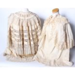 Two late 19th/early 20th Century cream lace-trimmed children's capes, and a quantity of