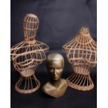 A 1950s composition gold painted Manning hat shop display bust, and a pair of 1950s mannequin wicker