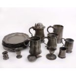 An 18th century pewter lidded tankard of baluster form, with touch marks height 20cm, handle