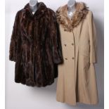 A 1970s pale coloured ladies mac with a fox fur collar; a musquash and suede coat, a dark brown