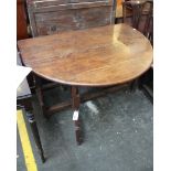 An early 18th century oak gateleg table, of oval outline, re-tipped, 129cm extended