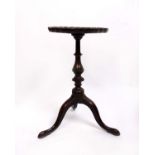 A George III mahogany 'kettle' stand with a 'pie crust' top, parts 18th century, leg detached, old