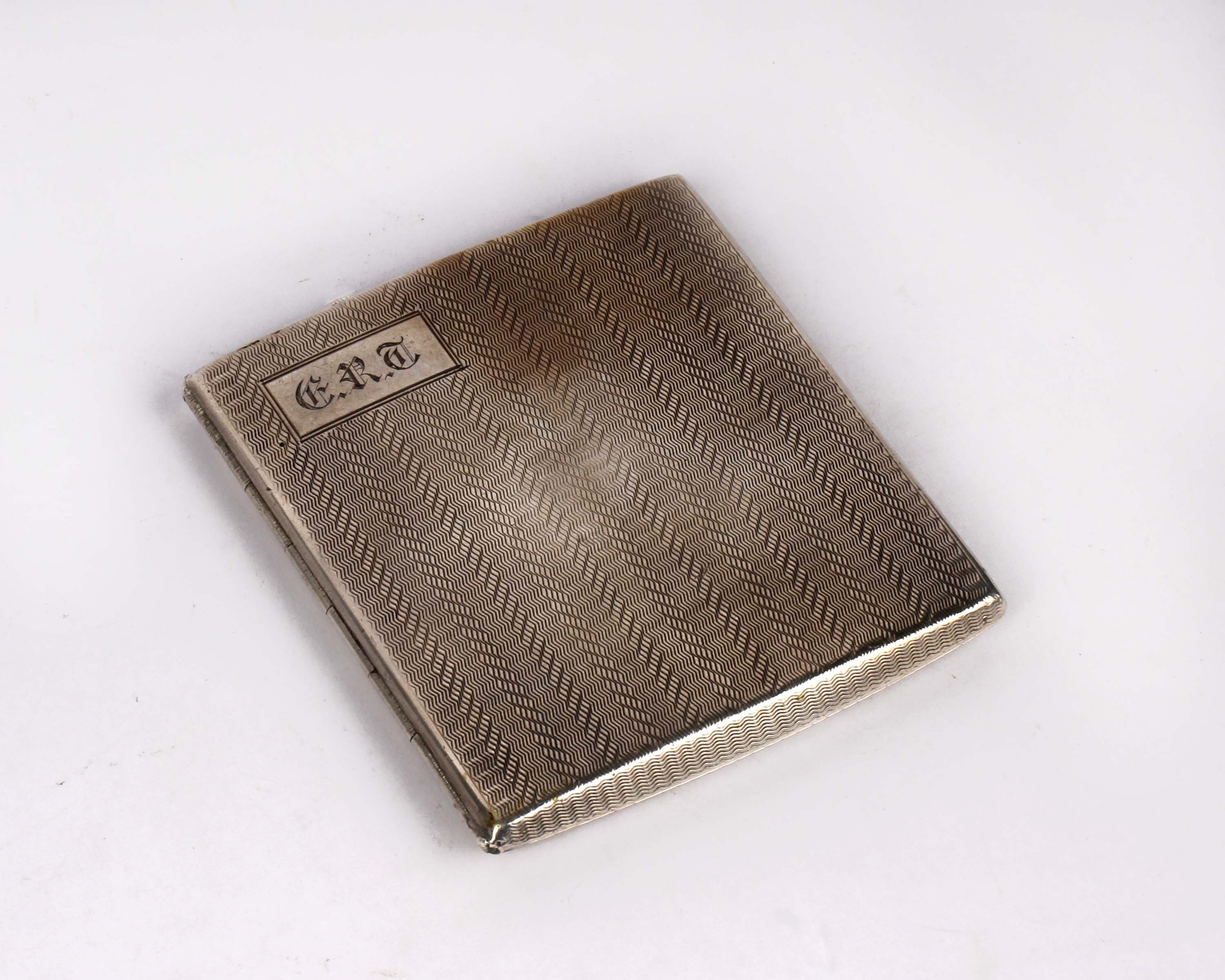 A sterling silver cigarette case with engine turned design by Deakin & Francis Ltd, Birmingham.