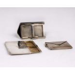 Two sterling silver stamp cases the first by Ahronsberg Brothers, Birmingham with green cabochon