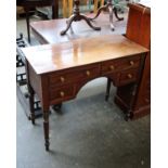 A 19th century mahogany writing table fitted with two long and two short drawers and on slender