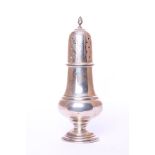 An Edwardian sterling silver sugar shaker, by William Devenport, Birmingham 1907, with pierced domed