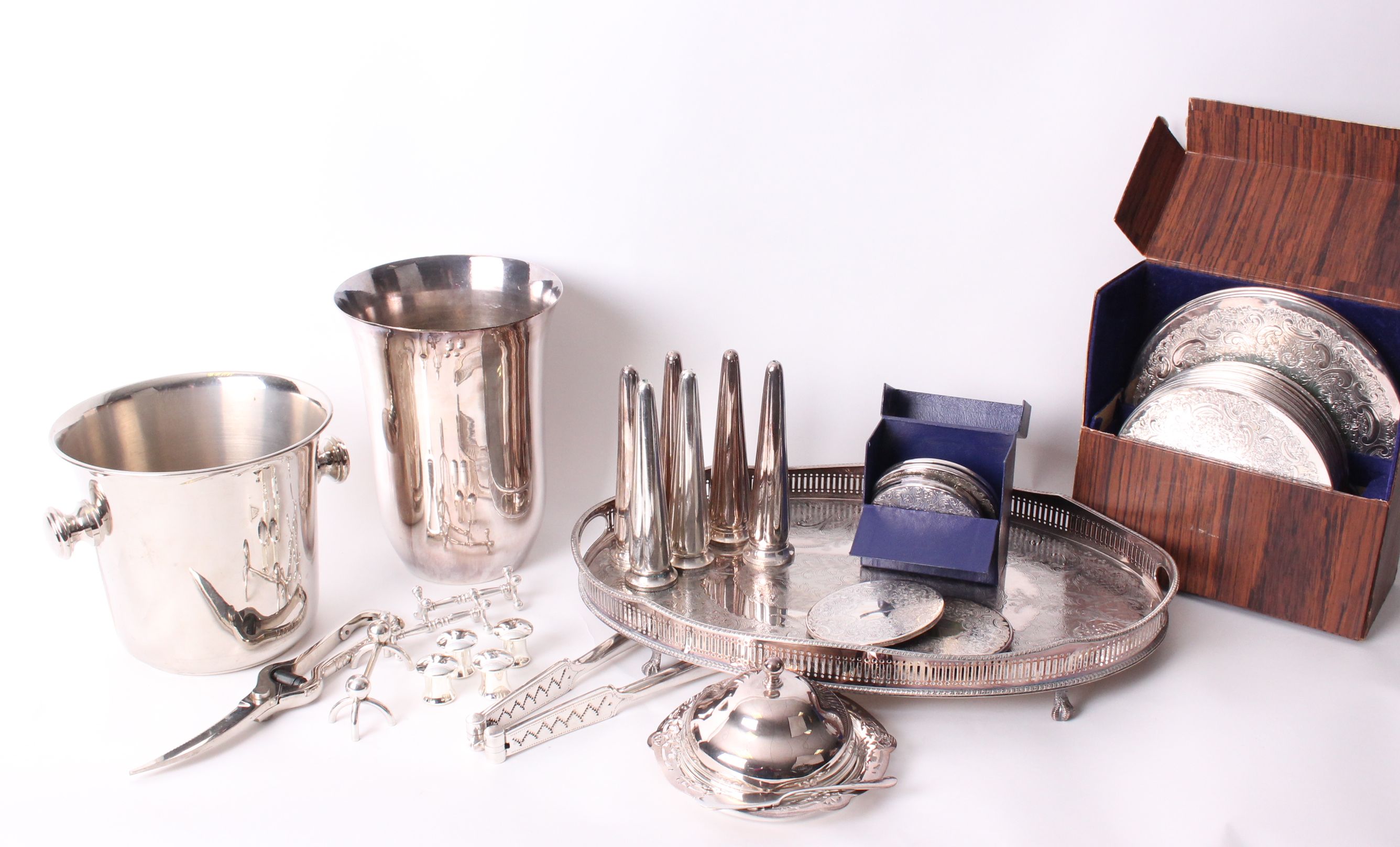 A collection of electroplated wares, to include silver plated place settings with matching coasters,
