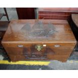 An oriental hard wood chest. The top and front of chest carved with 'Junks'