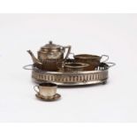 A miniature sterling silver three piece tea set by Cornelius Desormeaux Saunders & James Francis