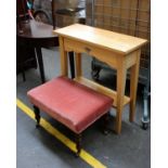 A modern golden oak side table with shelf under fitted drawer.