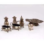 A large collection of sterling silver items to include a pierced silver bowl, pepperettes, salts and