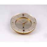 A mid century Tissot Calendar desk clock retailed by Birks . White face with date aperture at 6 with
