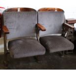 A set of early 20th century cinema seat, cast iron art nouveau style ends with mahogany arms. (
