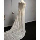 A long lace cloak, together with a silk blouse.