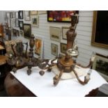 Two Edwardian carved oak six branch chandeliers in the arts and craft style larger one signed A.